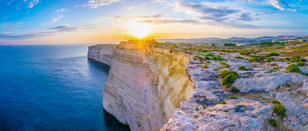 Sunset view over Ta Cenc cliffs on Gozo, Malta
