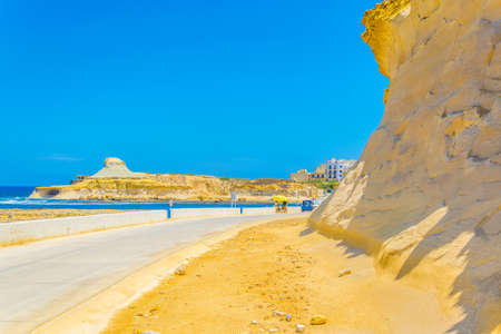 Seaside promenade alnongside salt pans near Marsalforn, Gozo, Maltaの写真素材