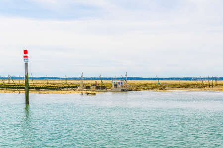 Marshes and oyster farms on the Ile aux Oiseaux near Arcachon, Franceの写真素材