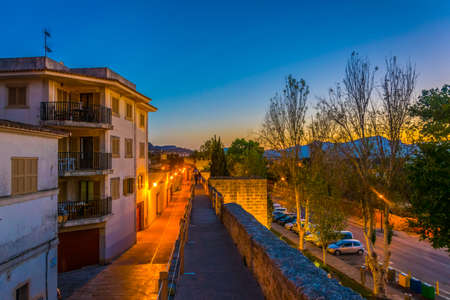 Sunset view of fortification of Alcudia town at Mallorca, Spain