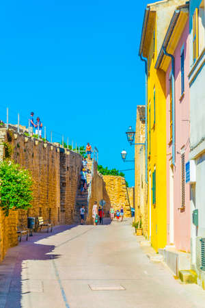View of a narrow street in the old town of Alcudia, Mallorca, Spainの写真素材