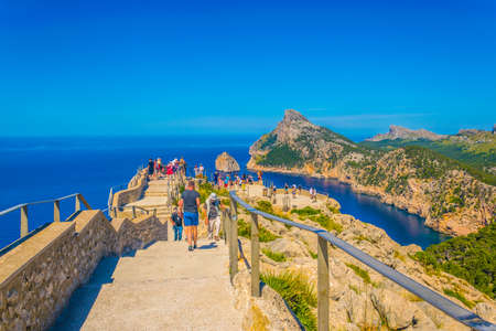 ES COLOMER, SPAIN, MAY 24, 2017: People are enjoying view from Es Colomer viewpoint, Mallorca, Spain
