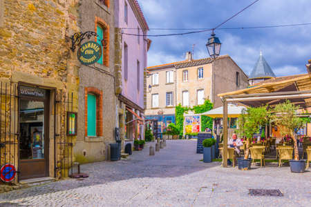 CARCASSONNE, FRANCE, JUNE 28, 2017: People are strolling through an alley in the old town of Carcassonne, Franceのeditorial素材