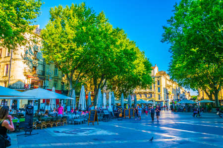 AVIGNON, FRANCE, JUNE 18, 2017: People are strolling through a narrow street in the center of Avignon, Franceのeditorial素材