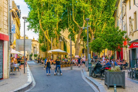 AVIGNON, FRANCE, JUNE 19, 2017: People are strolling through a narrow street in the center of Avignon, Franceのeditorial素材