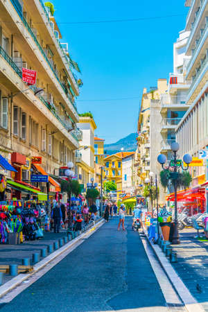 NICE, FRANCE, JUNE 11, 2017: People are strolling through a narrow street in the center of Nice, Franceのeditorial素材