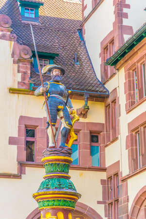 Soldier on top of a fountain in the old town of Basel, Switzerlandの写真素材