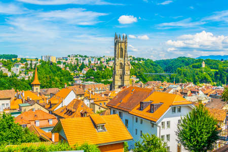 Cityscape of Fribourg dominated by tower of the cathedral of Saint Nicholas, Switzerland