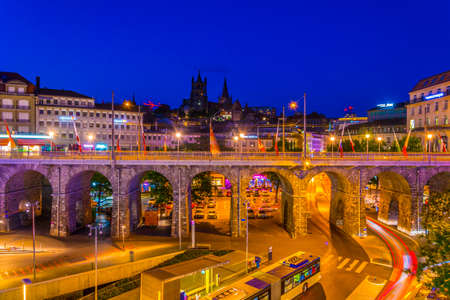 Night view of Cathedral of our lady viewed behind the Grand Pont in Lausanne, Switzerland
