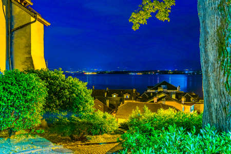 Night view of Geneva lake from terrace next to the Nyon Palace, Switzerlandの写真素材