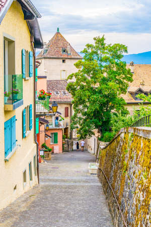 View of a narrow street in the swiss town Nyon, Switzerlandの写真素材