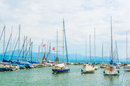 Boats floating on Geneva lake also called as Lac Leman in Switzerland near Morgesの写真素材