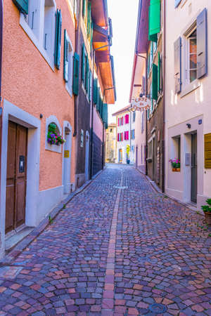 LUTRY,  SWITZERLAND, JULY 18, 2017: View of a narrow street in the old town of Lutry during a summer...