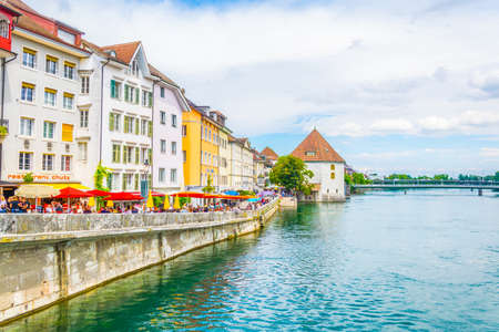 SOLOTHURN, SWITZERLAND, JULY 15, 2017:  People are walking on riverside of Aare passing through...