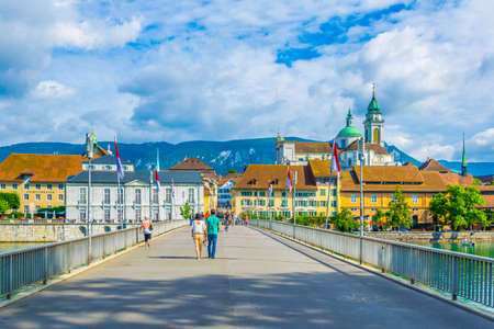SOLOTHURN, SWITZERLAND, JULY 15, 2017: People are crossing Kreuzackerbrucke over river Aare in Solothurn, Switzerlandのeditorial素材