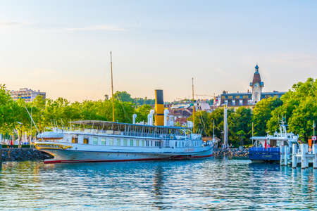 LAUSANNE,  SWITZERLAND, JULY 18, 2017: Passenger ferry is arriving to the pier at port at Lausanne, Switzerlandのeditorial素材