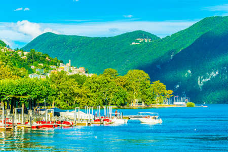 LUGANO, SWITZERLAND, JULY 24, 2017: Marina in Lugano with Monte Bré mountain on background Switzerlandのeditorial素材