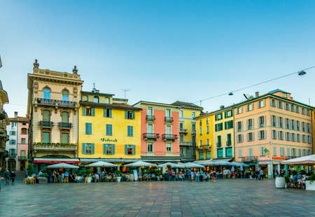 LUGANO, SWITZERLAND, JULY 24, 2017: People are strolling through central square in Lugano,...