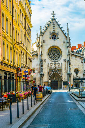 LYON, FRANCE, JULY 22, 2017: People are walking towards Shrine of St. Bonaventure in the historical...
