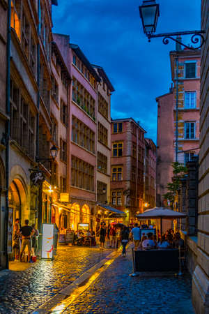 LYON, FRANCE, JULY 22, 2017: People are strolling through the old town of lyon during sunset, France