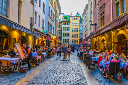 LYON, FRANCE, JULY 23, 2017: People are strolling through the old town of lyon during sunset, France