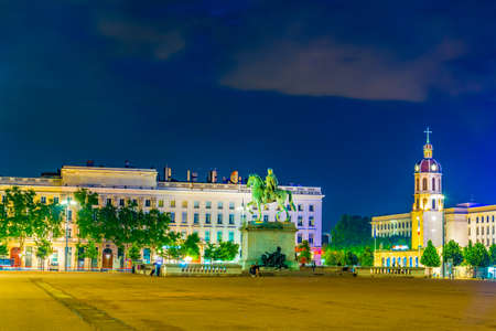 Night view of statue of Louis XIV on Place Bellecour in Lyon, Franceの写真素材