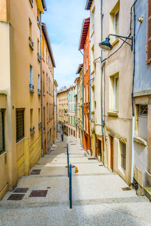 a narrow street in the historical center of Vienne, Franceの写真素材