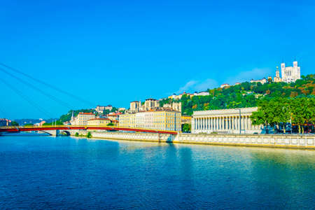 Basilique Notre Dame de Fourvière viewed behind river Saone in Lyon, France
