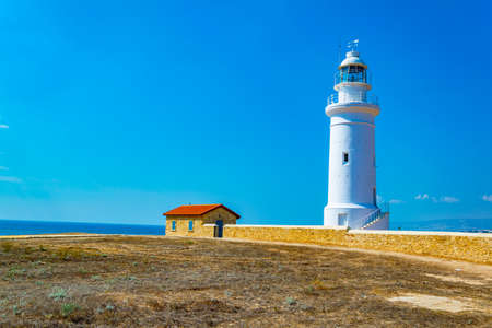 White lighthouse situated in Paphos Archaeological Park on Cyprusの写真素材
