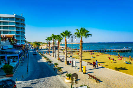 LARNACA, CYPRUS, AUGUST 15, 2017: People are enjoying a sunny day on Finikoudes promenade in Larnaca, Cyprusのeditorial素材