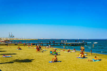 LARNACA, CYPRUS, AUGUST 15, 2017: People are enjoying a sunny day at a beach at Larnaca, Cyprusのeditorial素材
