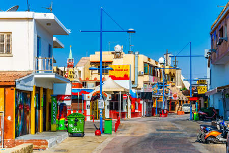AGIA NAPA, CYPRUS, AUGUST 15, 2017: Street with plentiful tourist shops and restaurants at Agia Napa, Cyprusのeditorial素材