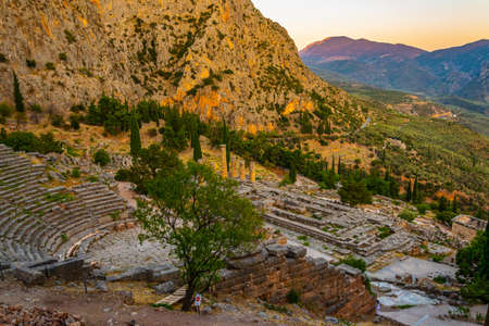 Sunset view of ruins of theatre at ancient Delphi, Greece