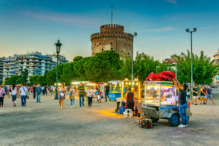 THESSALONIKI, GREECE, SEPTEMBER 8, 2017: Food stands in front of the white tower in Thessaloniki during sunset, Greeceのeditorial素材