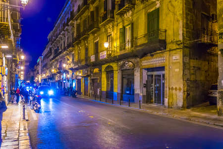 PALERMO, ITALY, APRIL 22, 2017: Night view of a narrow street in Palermo, Sicily, Italyのeditorial素材