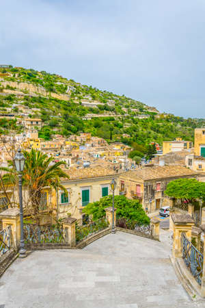 View of a stairway in Modica in Sicily overlooking city beneath itの写真素材