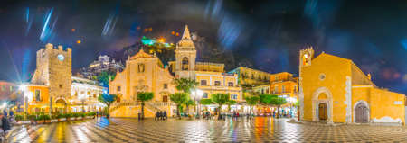 TAORMINA, ITALY, APRIL 24, 2017: People are strolling on piazza IX Aprile during night in Taormina, Sicily, Italyのeditorial素材