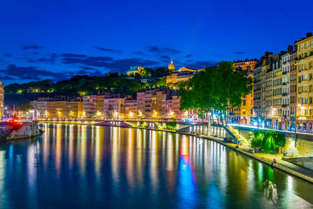 Night view of illuminated riverside of Saone river in Lyon, Franceの写真素材