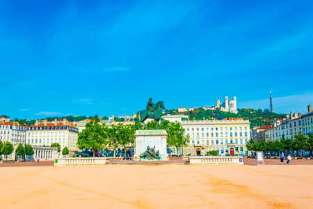 Basilica Notre-Dame de Fourviere viewed behind statue of Louis XIV in Lyon, Franceの写真素材