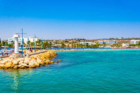 AGIA NAPA, CYPRUS, AUGUST 15, 2017: People are enjoying a sunny day at a beach at Agia Napa, Cyprusのeditorial素材