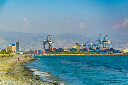 LIMASSOL, CYPRUS, AUGUST 17, 2017: Limassol viewed behind people swimming at Lady's mile beach on cyprusのeditorial素材
