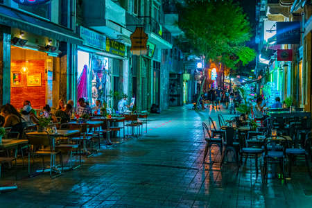 NICOSIA, CYPRUS, AUGUST 24, 2017: Night view of pedestrian center of Nicosia where tourists enjoy relaxing evening after a hot summer day, Cyprusのeditorial素材