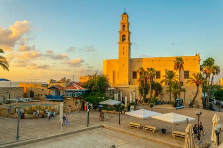 TEL AVIV, ISRAEL, SEPTEMBER 9, 2018: People are walking towards Saint Peter church in Jaffa, Tel...