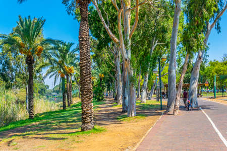 TEL AVIV, ISRAEL, SEPTEMBER 10, 2018: People are enjoying a sunny day at a promenade alongside river Yarkon in Tel Aviv, Israelのeditorial素材