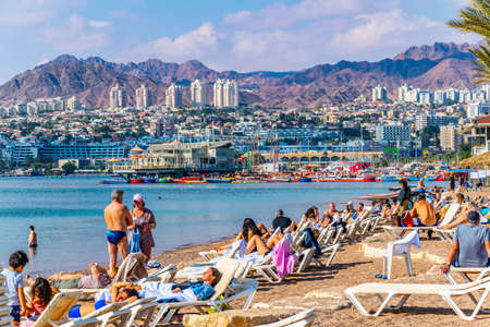 EILAT, ISRAEL, DECEMBER 30, 2018: People are enjoying a sunny day on a beach in Eilat, Israelのeditorial素材