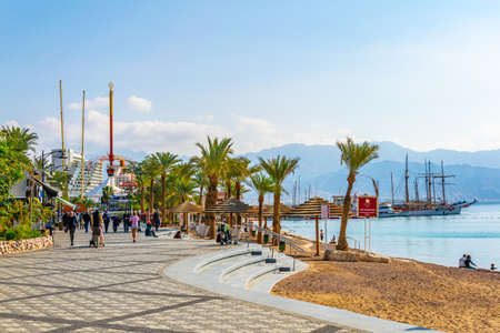 EILAT, ISRAEL, DECEMBER 30, 2018: People are enjoying a sunny day on a beach in Eilat, Israelのeditorial素材