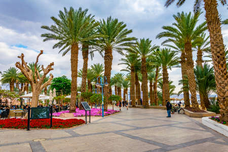 EILAT, ISRAEL, DECEMBER 30, 2018: People are strolling on seaside promenade in Eilat, Israel