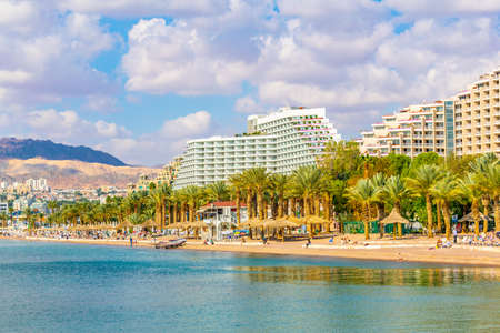 EILAT, ISRAEL, DECEMBER 30, 2018: People are enjoying a sunny day on a beach in Eilat, Israelのeditorial素材