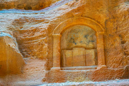 Stone carving on the wall of siq canyon in Petra, Jordanの写真素材