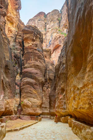 Siq canyon leading to the ancient ruins of Petra, Jordanの写真素材